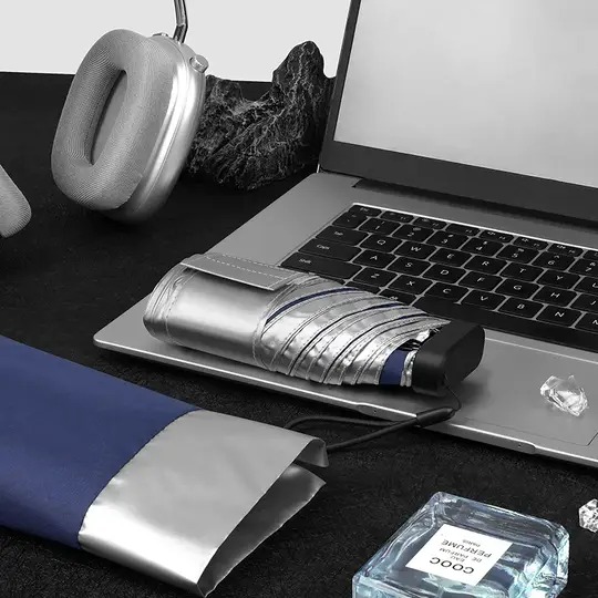 Custom mini 5-fold pocket umbrella with silver UV protection coating, showcasing ultra-lightweight travel capsule umbrella wholesale by a China manufacturer.