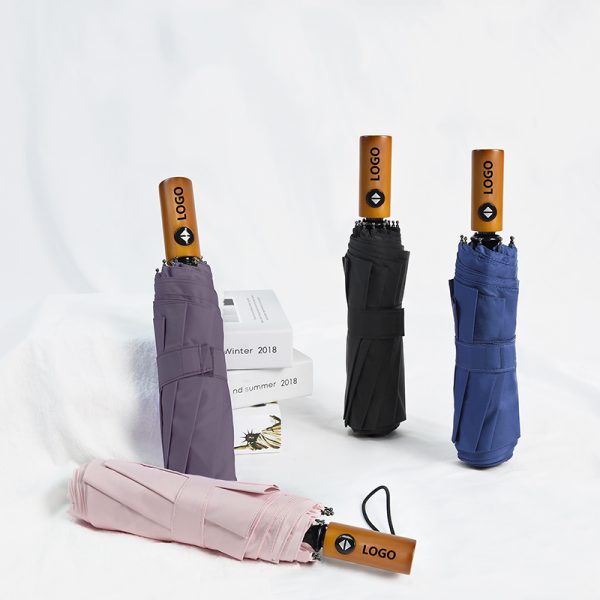 Custom automatic folding umbrellas with wooden handles, showcasing multi-color options and handle logo printing for promotional corporate gift wholesale by a China manufacturer.