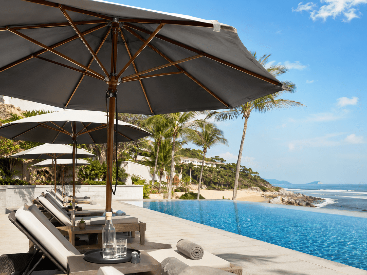 Custom commercial patio umbrellas for high-end hospitality branding, showcasing durable heavy-duty wooden market umbrellas provided by the manufacturer for luxury resort, beach club, and outdoor furniture promotional wholesale.